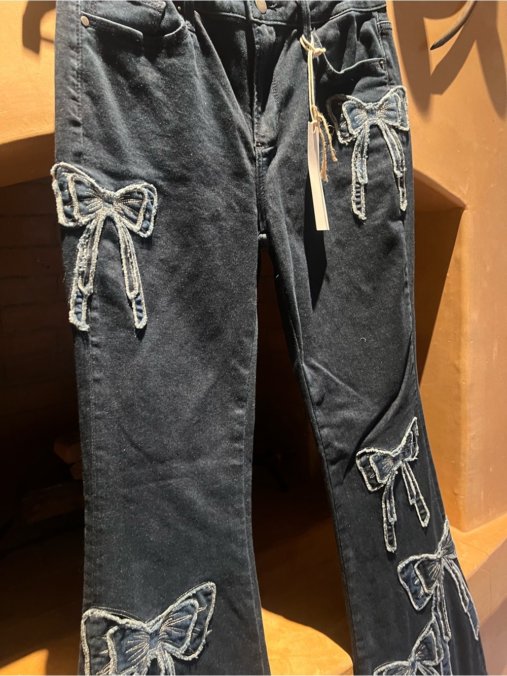 DRIFTWOOD Navy Washed Denim Jeans with bows accent - Picture 2 of 6
